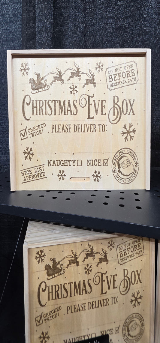Christmas Eve Box design with Santa's sleigh, reindeer, snowflakes, and a space for a personalized name.