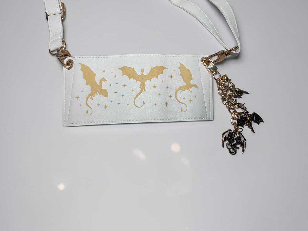 a white tag with gold dragon design on it