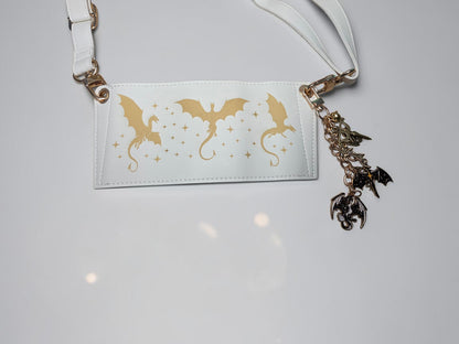 a white tag with gold dragon design on it