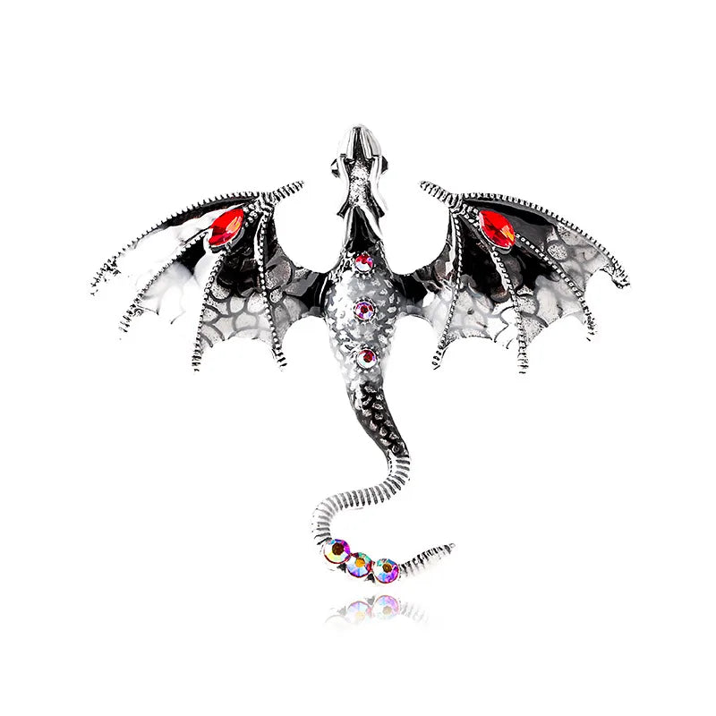 a black and white dragon with wings and colorful stones