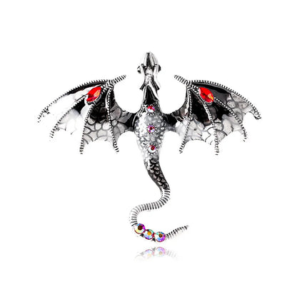 a black and white dragon with wings and colorful stones